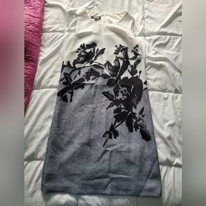 Sleeveless white and periwinkle dress with black flower detail